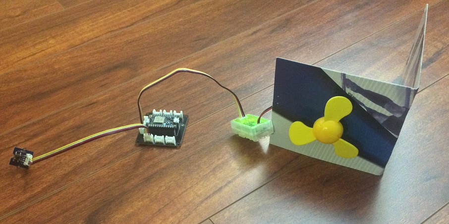 a picture showing a fan and button connected with photon